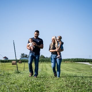 Brewer family walking on farm