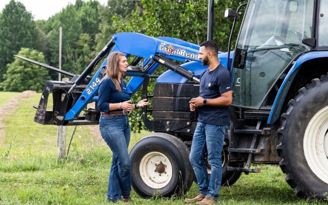 Loan officer talking to Farm Credit Mid-America farmer