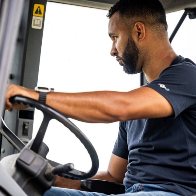 Man driving tractor